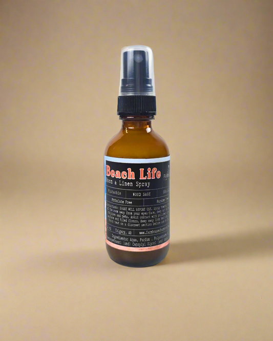 Wrap your space in the warm, nutty aroma of pistachio, cozy wood sage, and a breezy hint of sea salt—like a sun-soaked beach day in every spritz. It's coastal calm in a bottle! Beach Life Room Linen Spray-Farmhouse Charm Candles