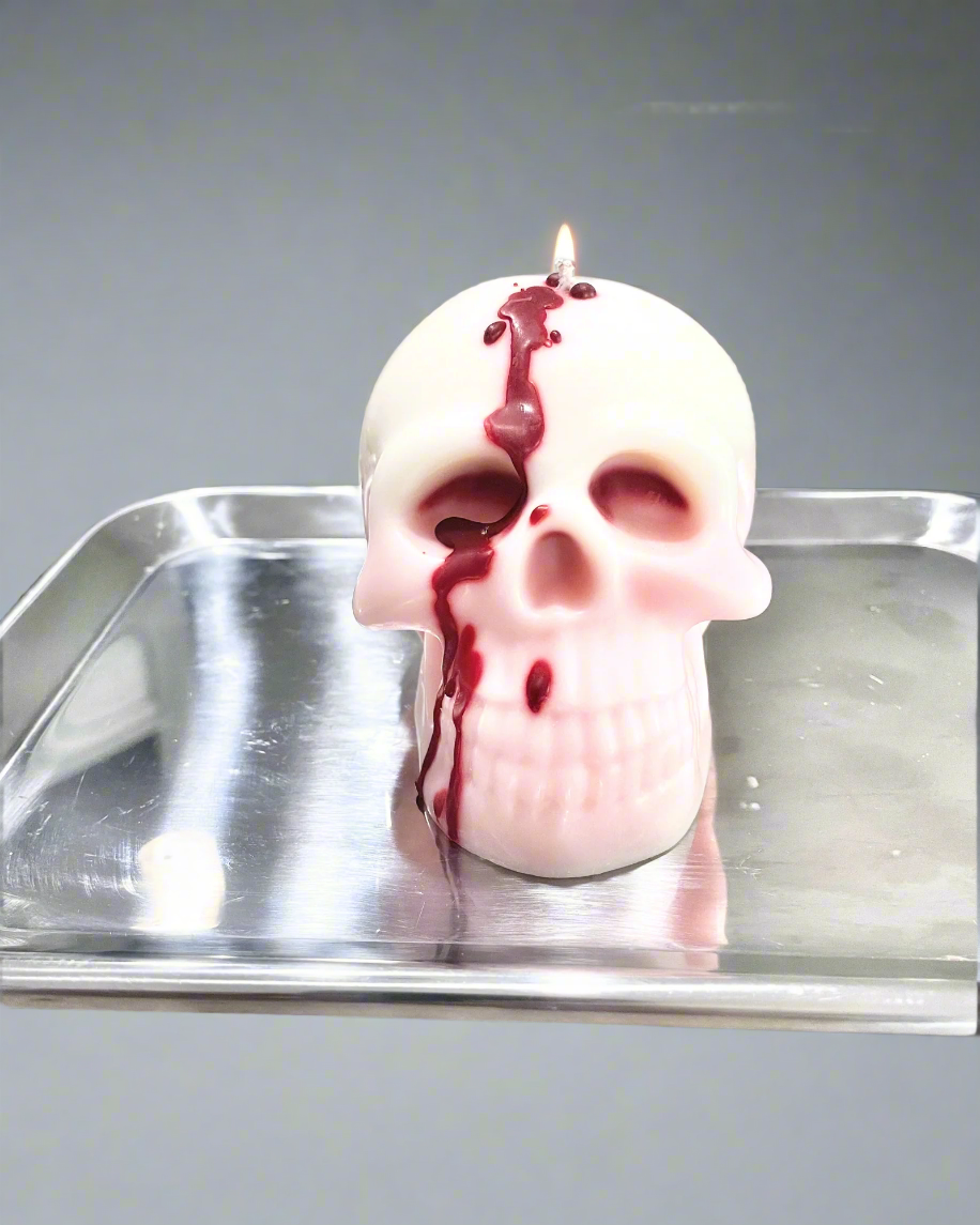 Bleeding Skull Soy Wax Pillar Candle is made with 100% natural soy wax. With a unique blend of rich berries, crisp apple, warm amber, and smooth sandalwood, our candle promises a delightful fragrance that is free of parabens and phthalates. Plus, with a cotton wick, we ensure an optimal burn every time. www.farmhousecharmcandles.com