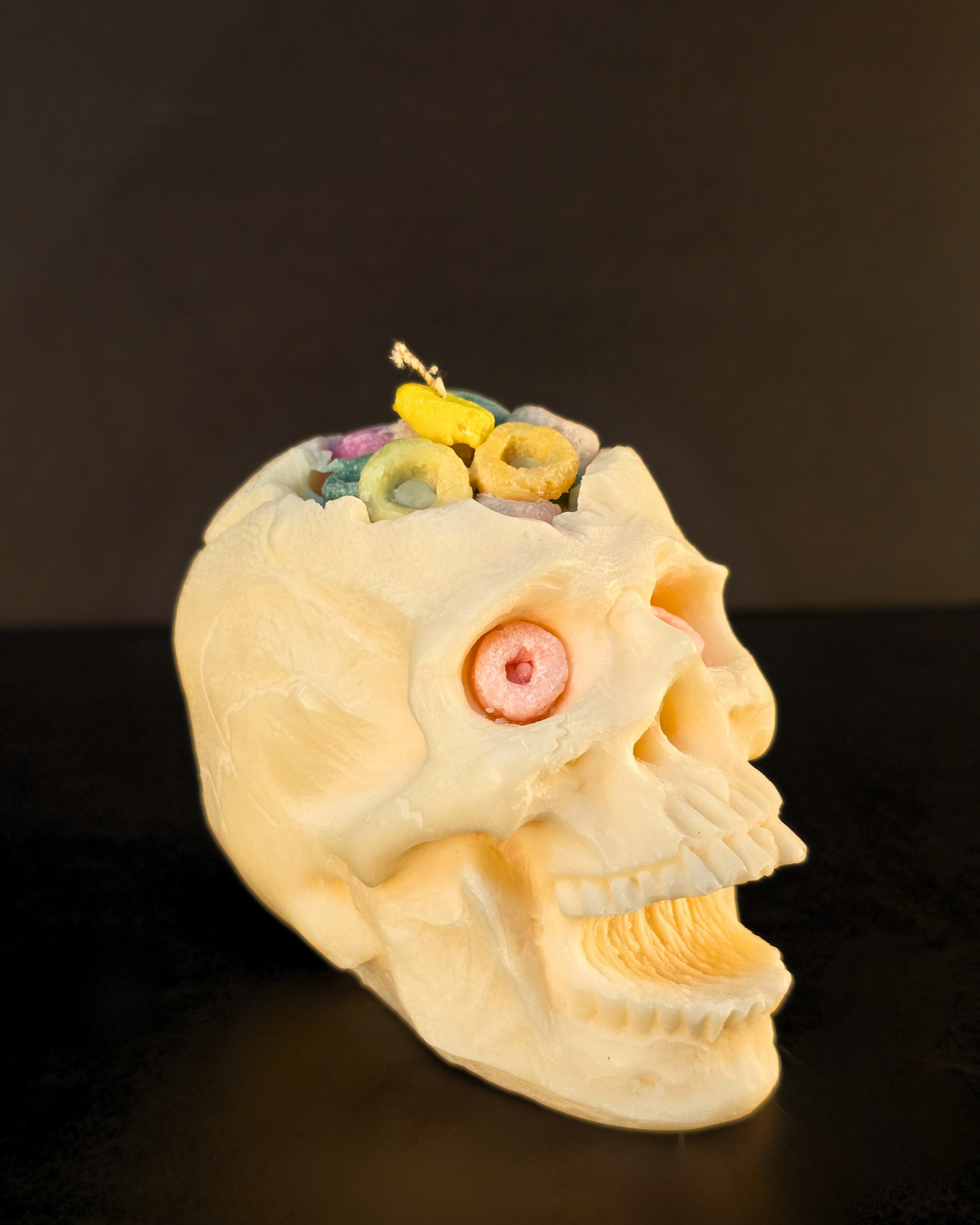 Cereal Killer Skull Candle – soy wax skull-shaped pillar candle with fruity cereal scent, eco-friendly and perfect for Halloween décor. Farmhouse Charm Candles