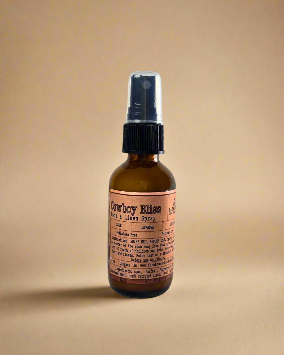 A rugged yet soothing mix of leather, sage, and lavender. This masculine-meets-floral scent brings a touch of the wild west to your home, linens, or car. One spray, and you're in a cozy retreat. Farmhouse Charm Candles