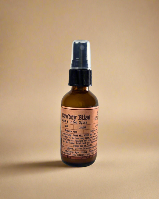 A rugged yet soothing mix of leather, sage, and lavender. This masculine-meets-floral scent brings a touch of the wild west to your home, linens, or car. One spray, and you're in a cozy retreat. Farmhouse Charm Candles