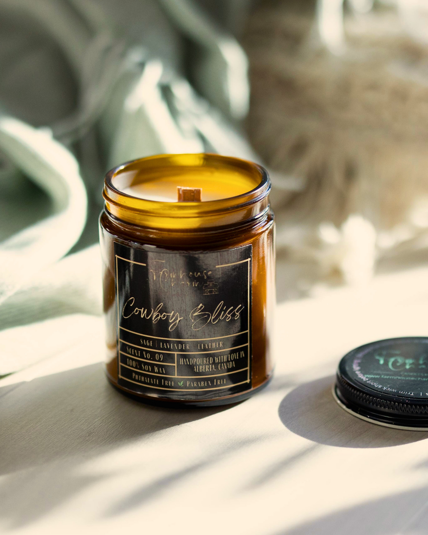 Experience the pleasure of Cowboy Bliss soy candle's aroma. Immerse yourself in the one-of-a-kind blend of wood sage, soft lavender, and leather. The fragrance provides an ideal balance of floral and subtle woody undertones that captivate the senses. As you light up the Cowboy Bliss soy candle, the aroma will fill your space, creating an ambiance that will transport you to the beautiful countryside. www.farmhousecharmcandles.com