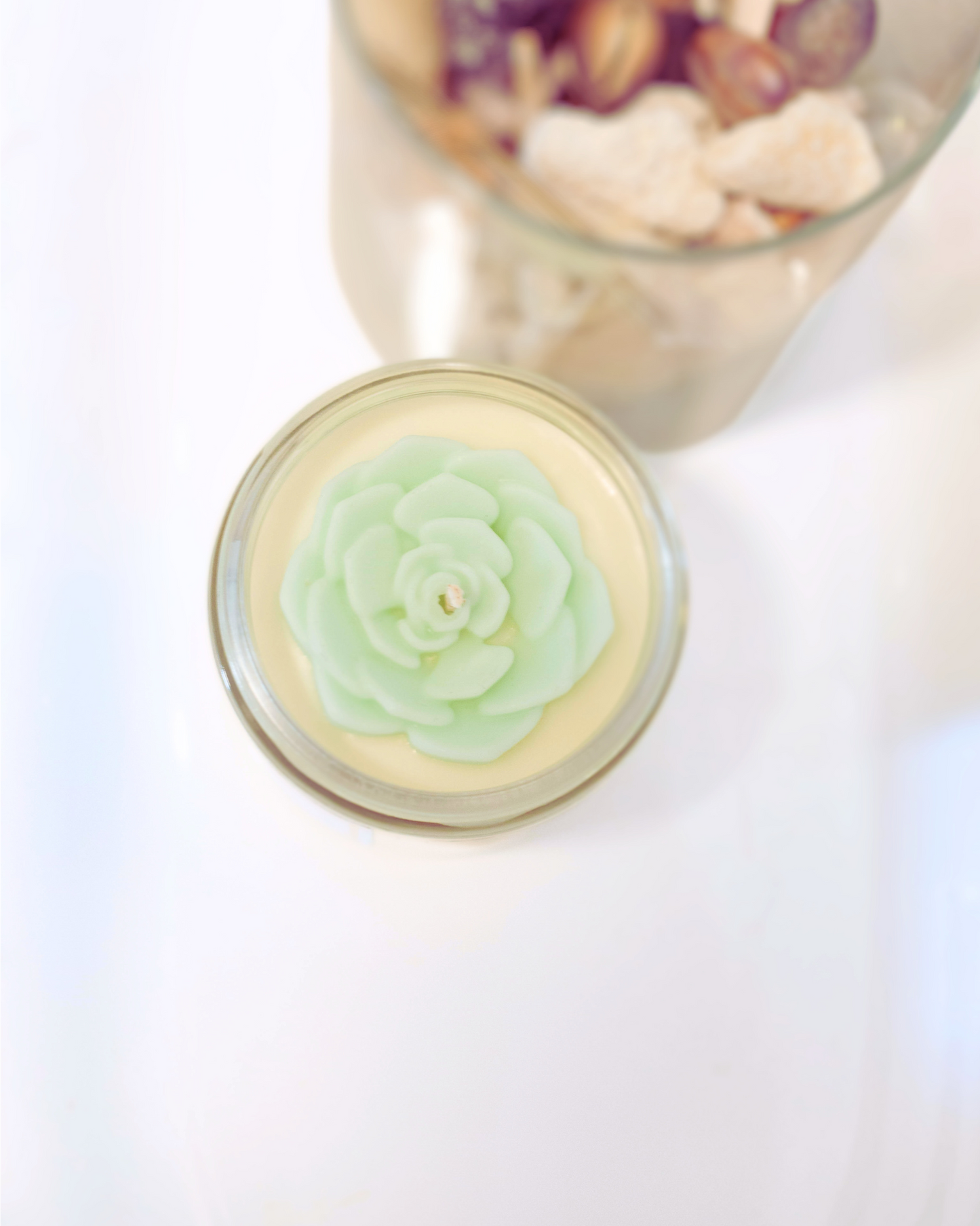 Experience the invigorating aroma of Orchid & Sea Salt - Farmhouse Charm Natural Soy Candle
. This soy candle offers a delightful blend of soft floral tones, including orchid, jasmine, and lily. The crisp and refreshing sea salt mist aroma adds an elegant touch to the fragrance, making it truly invigorating. The stunning mint-green soy wax top is shaped like a succulent, making it a unique addition to your decor. www.farmhousecharmcandles.com