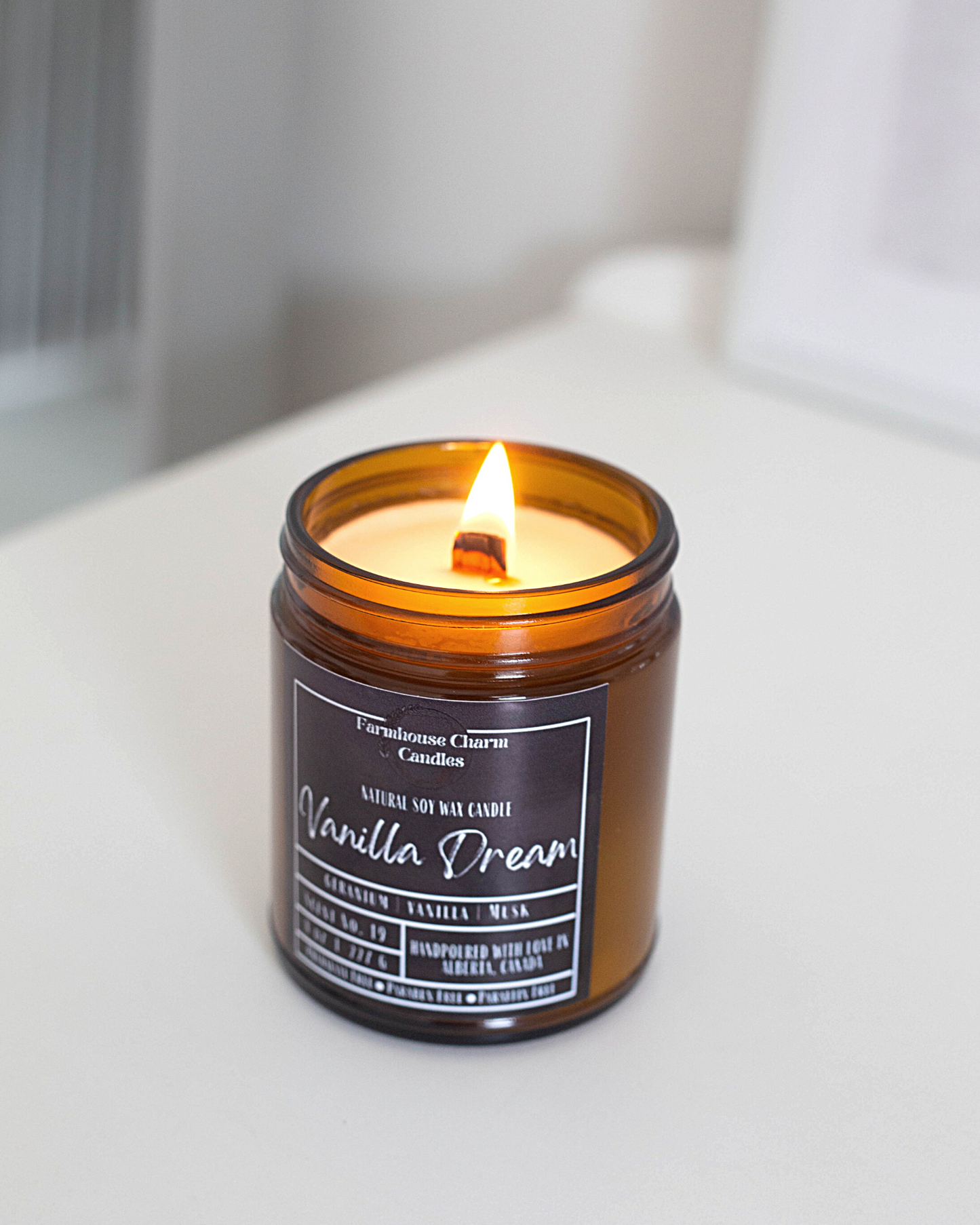 Experience the luxurious aroma of Vanilla Dream- Farmhouse Charm Soy Candle. Step up your candle game with this unique vanilla fragrance that will not disappoint. Indulge in a dreamy and lavish scent that awakens your senses with a blend of toasted vanilla, sweet geranium florals, and a touch of musk. size: 8 oz (227 g) The candle is hand poured with love in Alberta, Canada. It has an approximate burn time of 50 hours.