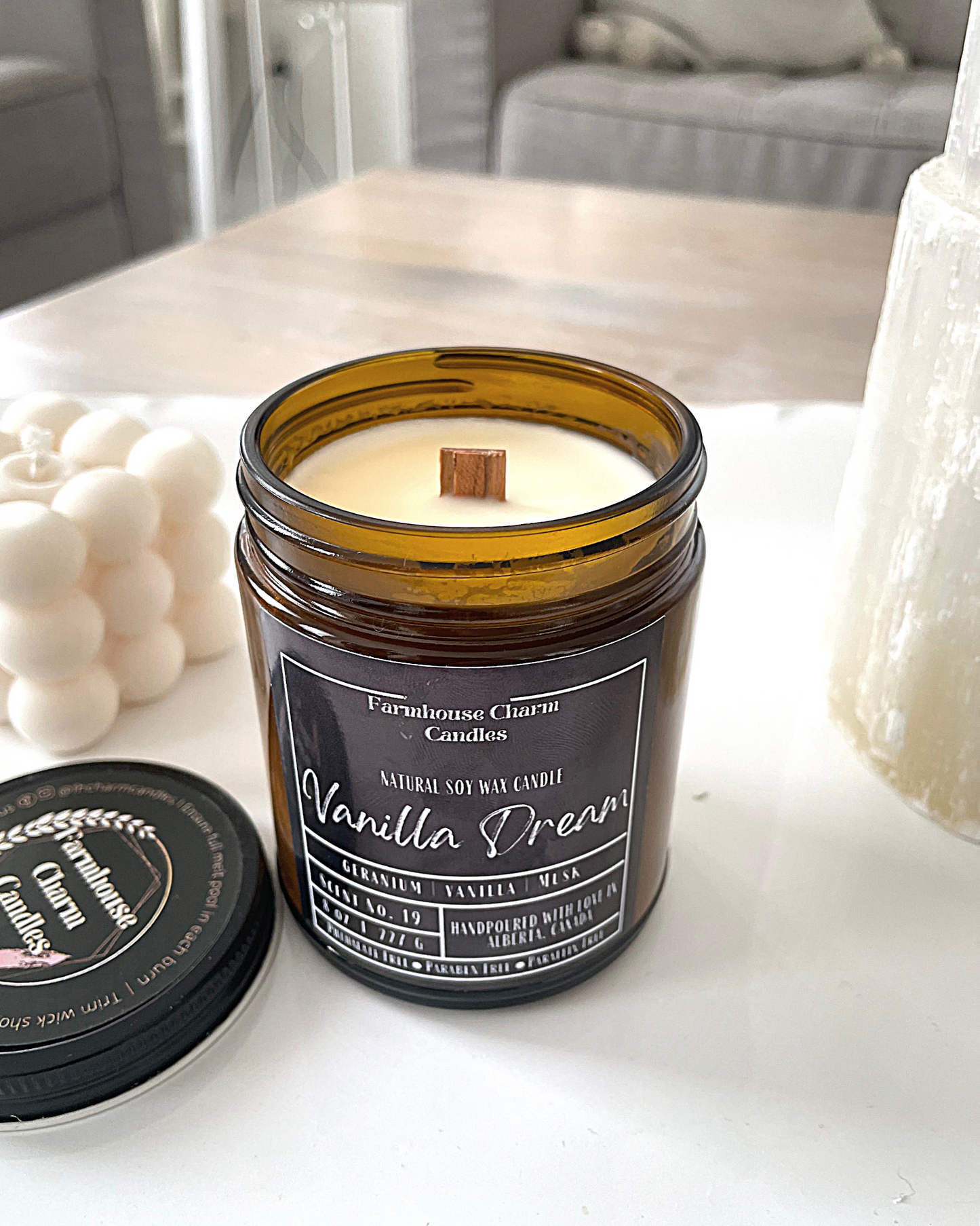 Experience the luxurious aroma of Vanilla Dream- Farmhouse Charm Soy Candle. Step up your candle game with this unique vanilla fragrance that will not disappoint. Indulge in a dreamy and lavish scent that awakens your senses with a blend of toasted vanilla, sweet geranium florals, and a touch of musk. size: 8 oz (227 g) The candle is hand poured with love in Alberta, Canada. It has an approximate burn time of 50 hours.
