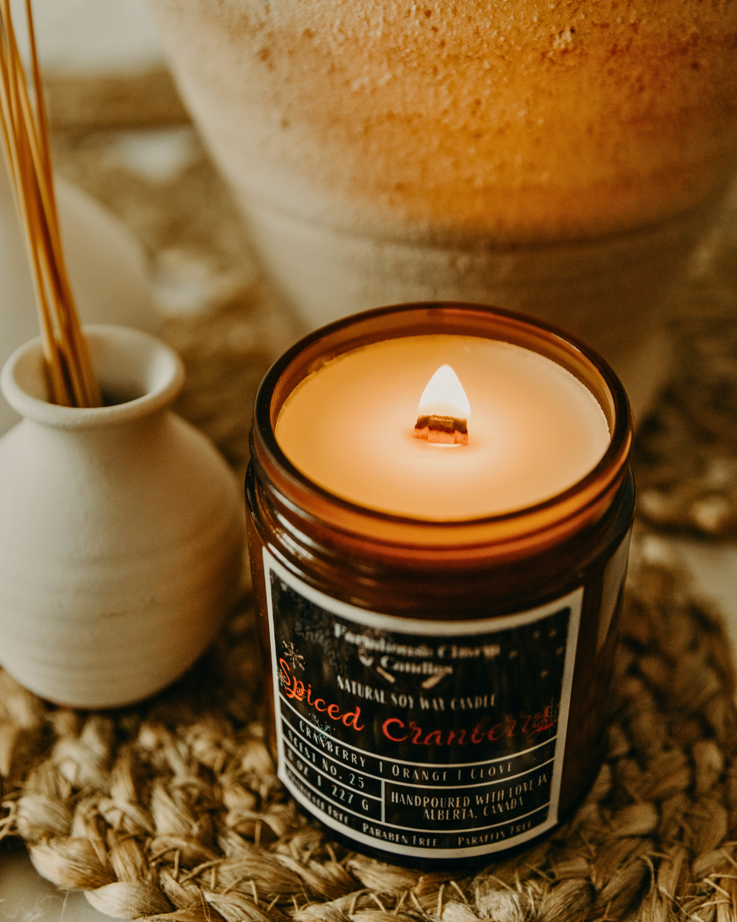 Experience the Festive Season with Spiced Cranberry Soy Candle. Our Spiced Cranberry Soy Candle embodies the true essence of the holiday spirit. The sweet and inviting aroma will fill any room with warmth and comfort. The tart cranberry and mulberry notes provide a refreshing and fruity scent, complemented by the tangy orange that adds a zesty twist. The combination of spicy clove and warm cinnamon creates a cozy ambiance, perfect for chilly winter nights. www.farmhousecharmcandles.com