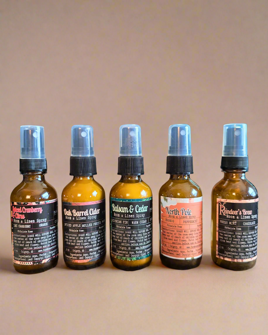 Farmhouse Charm Candles Christmas Room & Linen Spray Bundle featuring five festive scents displayed with holiday décor