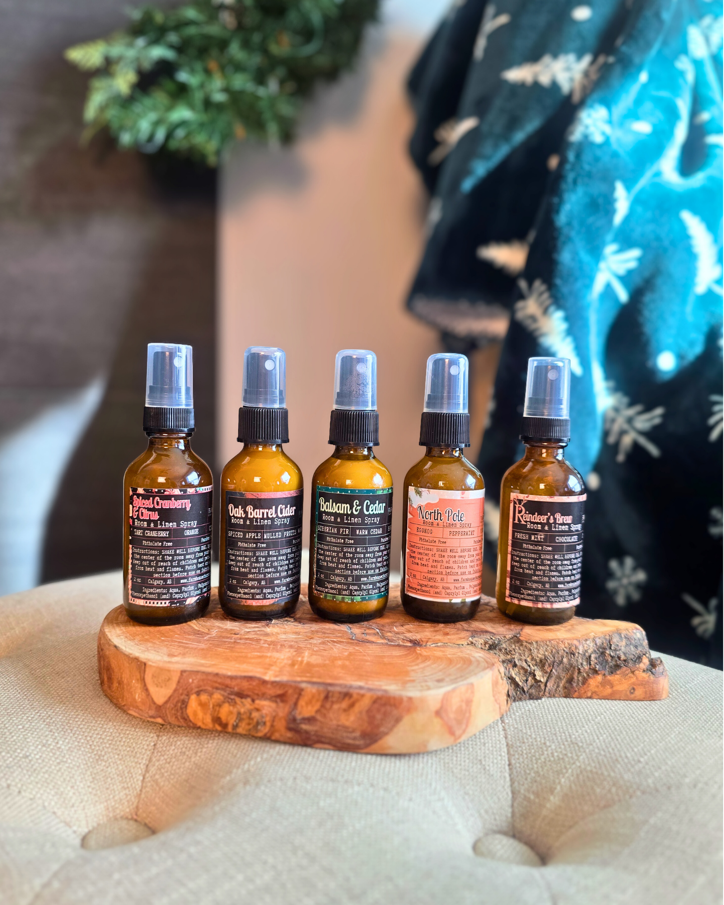 Farmhouse Charm Candles Christmas Room & Linen Spray Bundle featuring five festive scents displayed with holiday décor