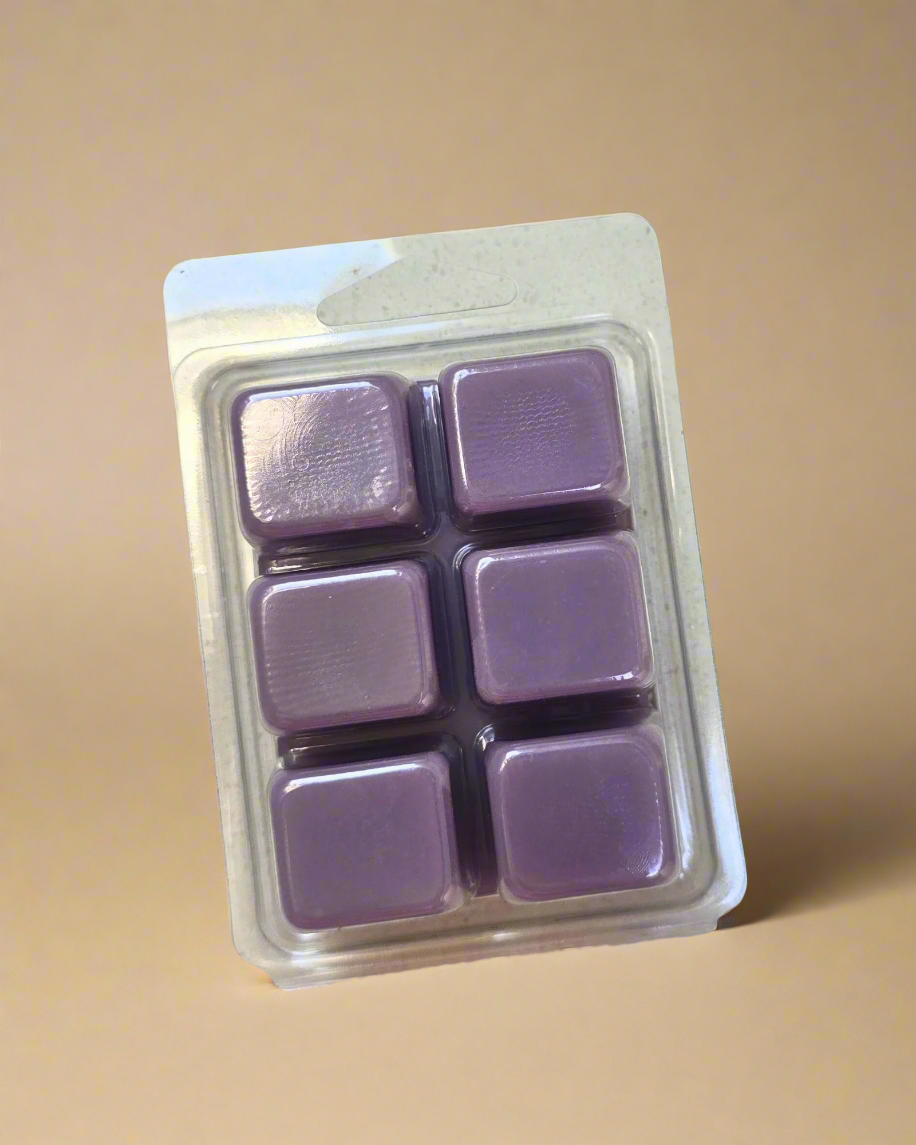 A fresh and elegant floral fragrance featuring blooming lilac petals, crisp dewy green leaves, and a soft touch of cedar leaf for a gentle woodsy finish. This scent captures the feeling of lilacs in full spring bloom—clean, airy, and beautifully inviting, bringing the freshness of a spring garden into your home. Lilac Dewdrops Soy Wax Melts - Farmhouse Charm Candles