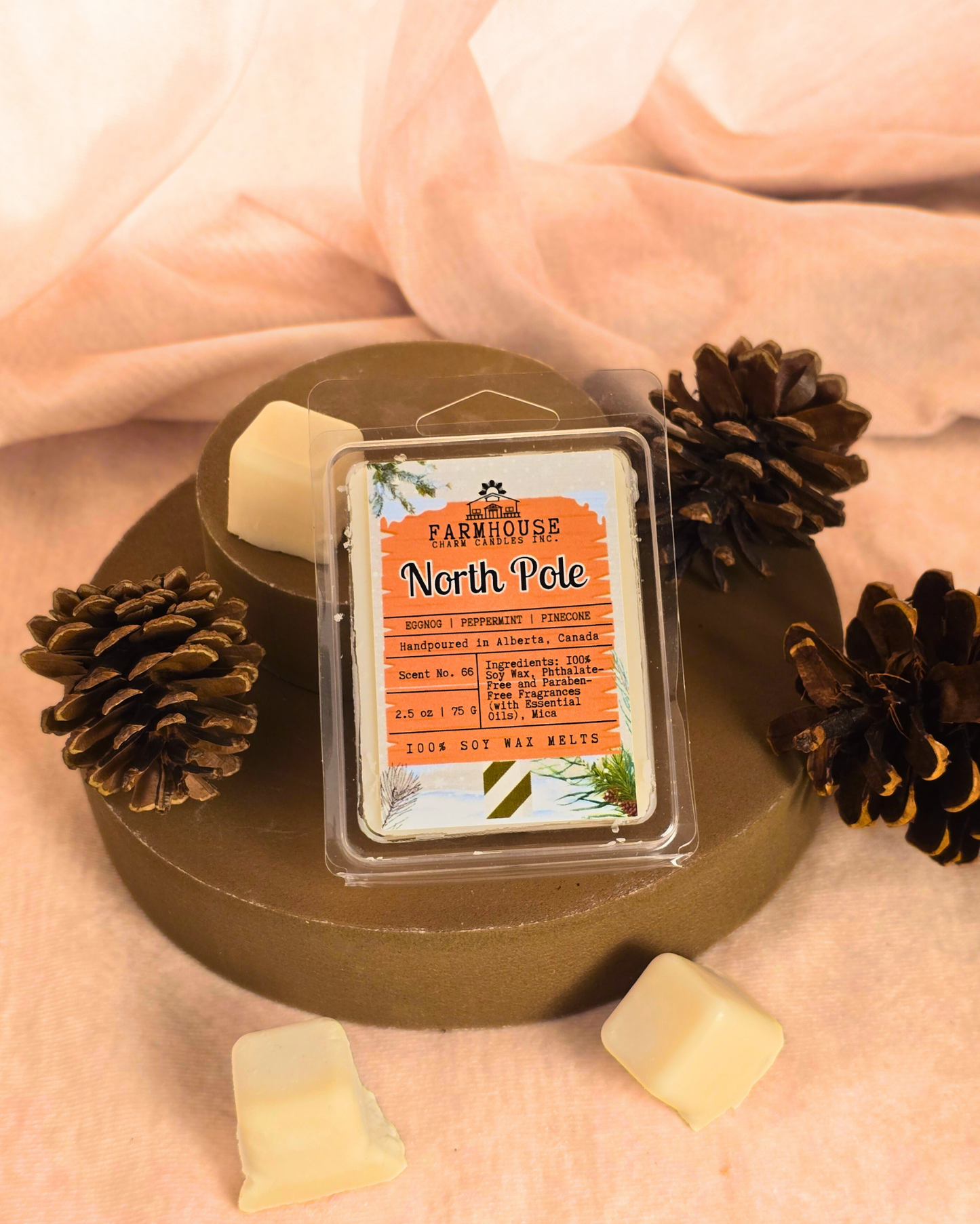 North Pole Wax Melts — creamy eggnog, cool peppermint, and pinecone scent soy wax melts displayed in a cozy farmhouse setting with festive holiday accents.