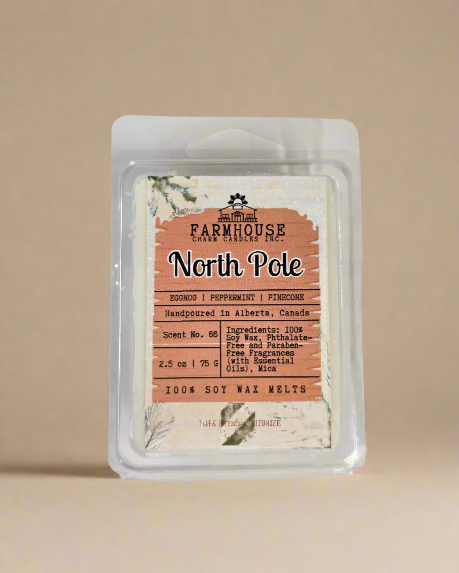 North Pole Wax Melts — creamy eggnog, cool peppermint, and pinecone scent soy wax melts displayed in a neutral background.