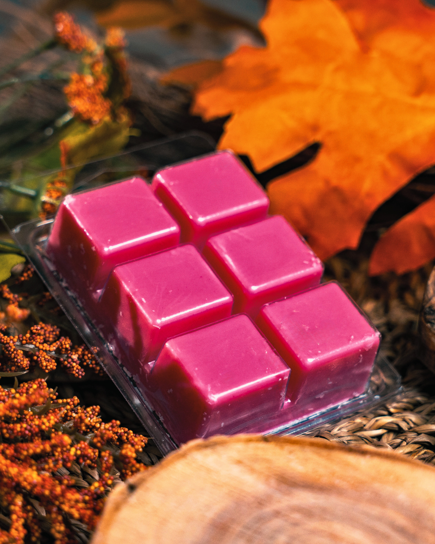 Farmhouse Charm Candles Oak Barrel Cider soy wax melt with a autumn-themed background.