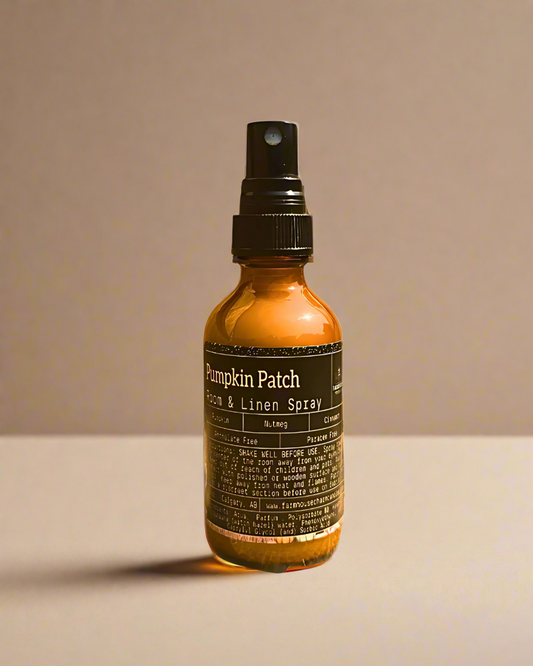 Pumpkin Patch room and linen spray bottle by Farmhouse Charm Candles  on a beige background