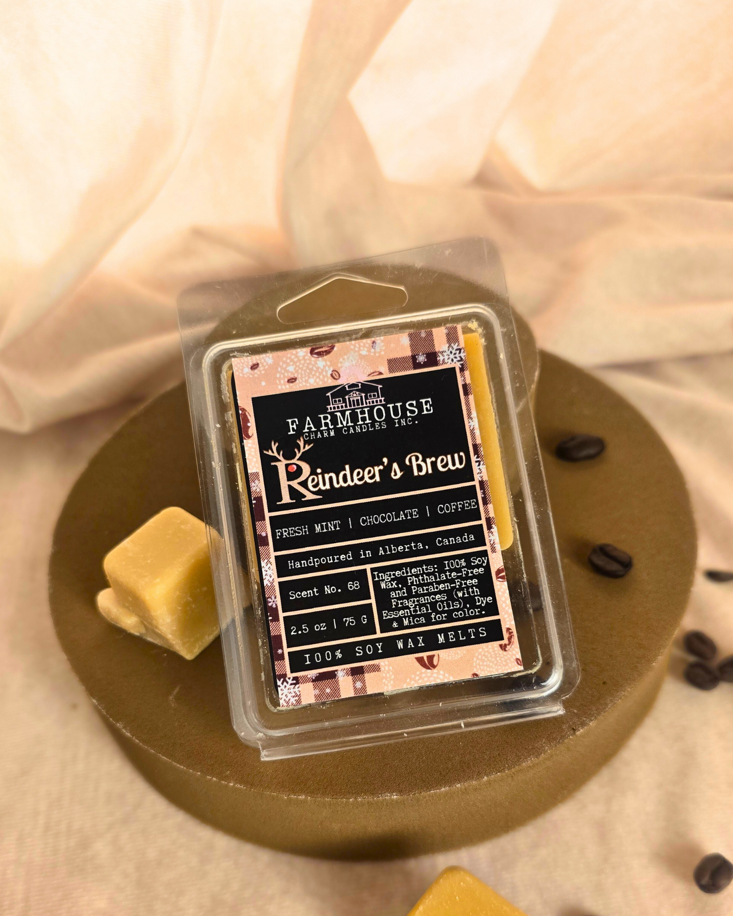 Reindeer’s Brew wax melts in festive shapes surrounded by coffee beans, and chocolate pieces — cozy holiday fragrance from Farmhouse Charm Candles.