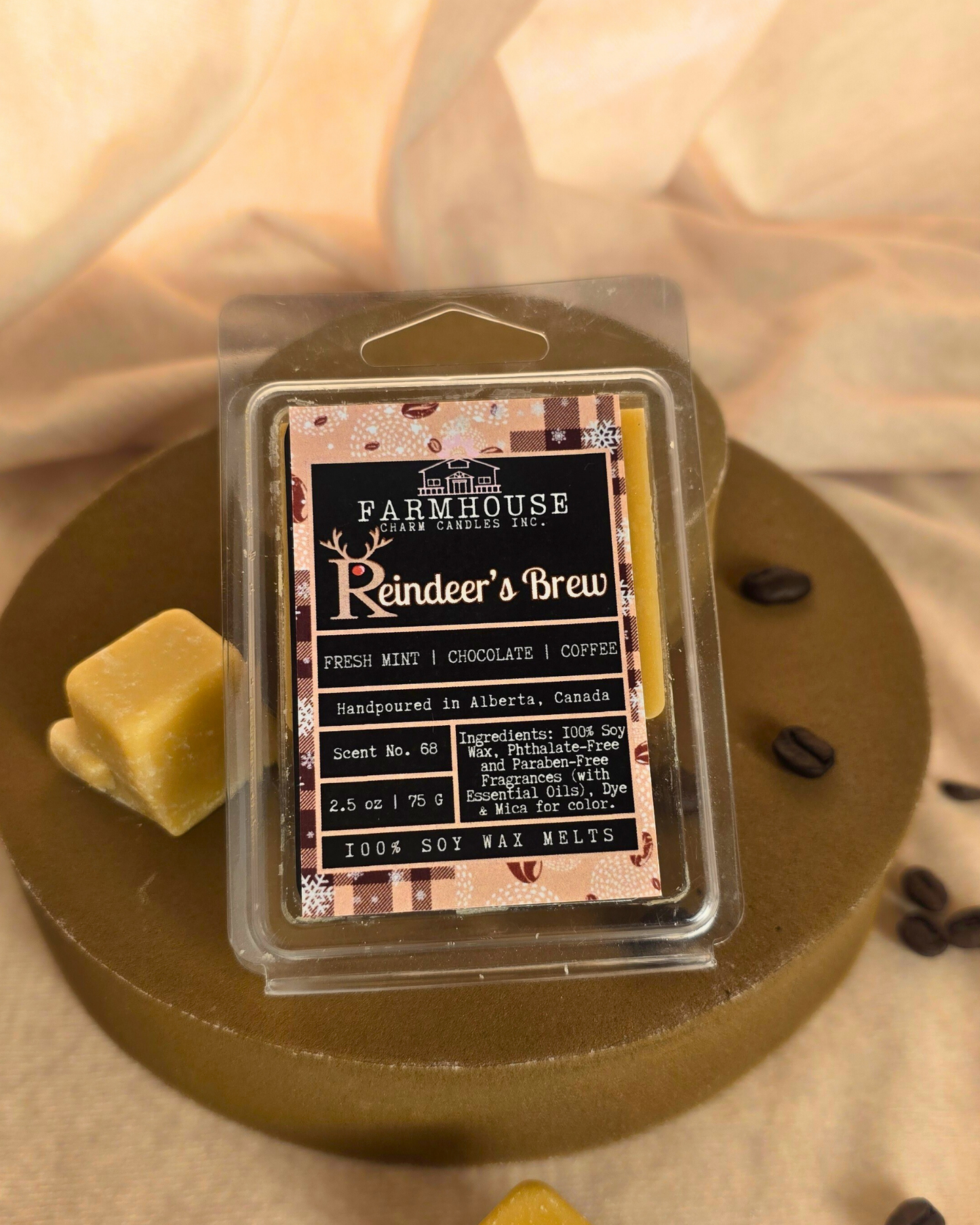 Reindeer’s Brew wax melts in festive shapes surrounded by coffee beans, and chocolate pieces — cozy holiday fragrance from Farmhouse Charm Candles.