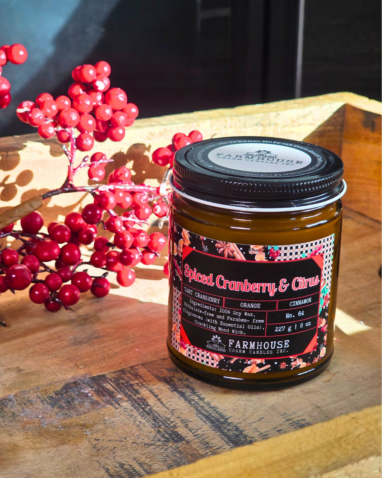 Spiced Cranberry & Citrus soy candle by Farmhouse Charm Candle in amber jar surrounded by fresh cranberries and cinnamon sticks — a cozy holiday scent that blends tart, sweet, and warm notes.