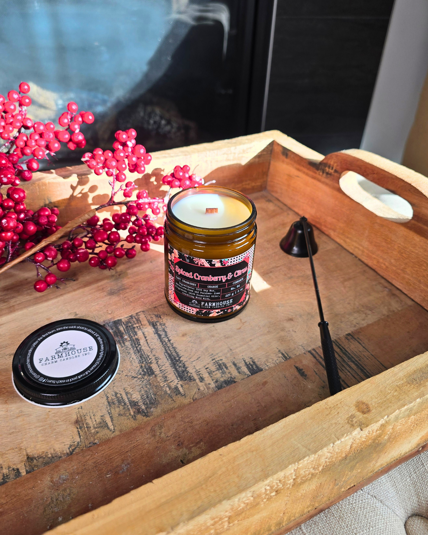Spiced Cranberry & Citrus soy candle by Farmhouse Charm Candle in amber jar surrounded by fresh cranberries and cinnamon sticks — a cozy holiday scent that blends tart, sweet, and warm notes.