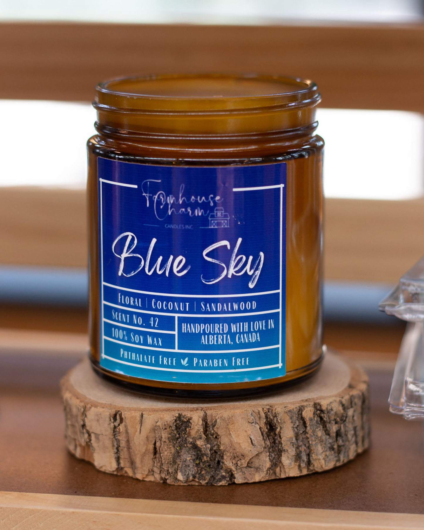 Blue Sky - Farmhouse Charm Soy Candle has a delightful blend of floral, coconut, and sandalwood scents that will fill your home with a calming atmosphere. Floral notes of fresh flowers and green botanicals create a soothing and inviting atmosphere, while the coconut and sandalwood create a warm and comforting ambience. Together, these scents combine to create an atmosphere that evoke the feeling of a bright and sunny spring day!www.farmhousecharmcandles.com