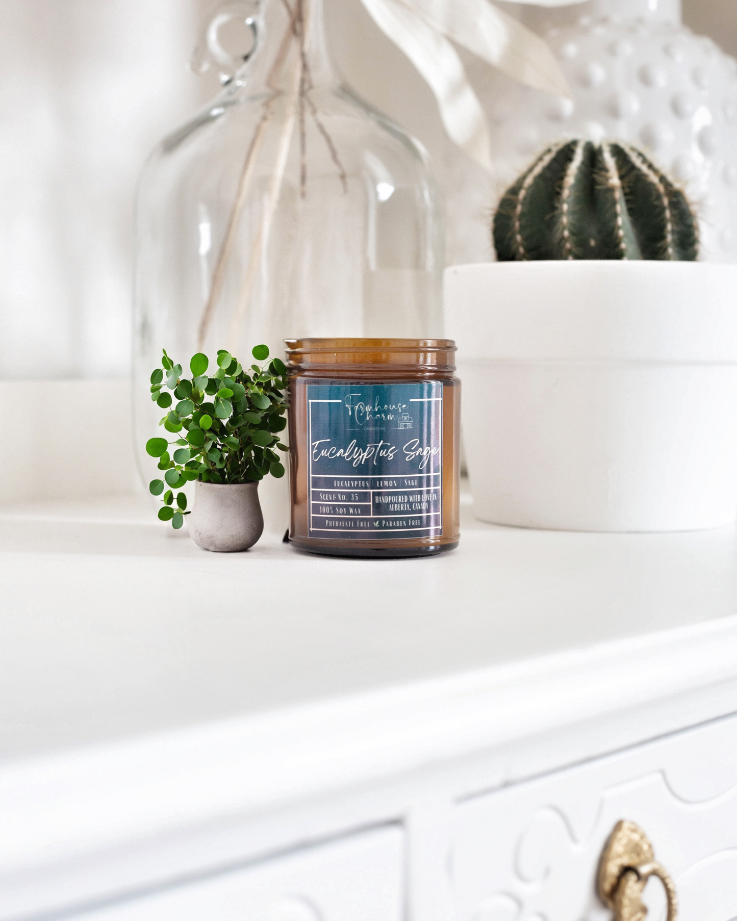 Introducing Our New Classic Fragrance: Eucalyptus Sage - Farmhouse Charm Soy Candle. Experience the soothing and clean aroma of our latest candle blend. This unique blend of eucalyptus and woody sage creates an herbal scent that's complemented by a refreshing splash of lemon. Perfect for unwinding and clearing your mind, this candle is a must-have for anyone seeking relaxation.www.farmhousecharmcandles.com