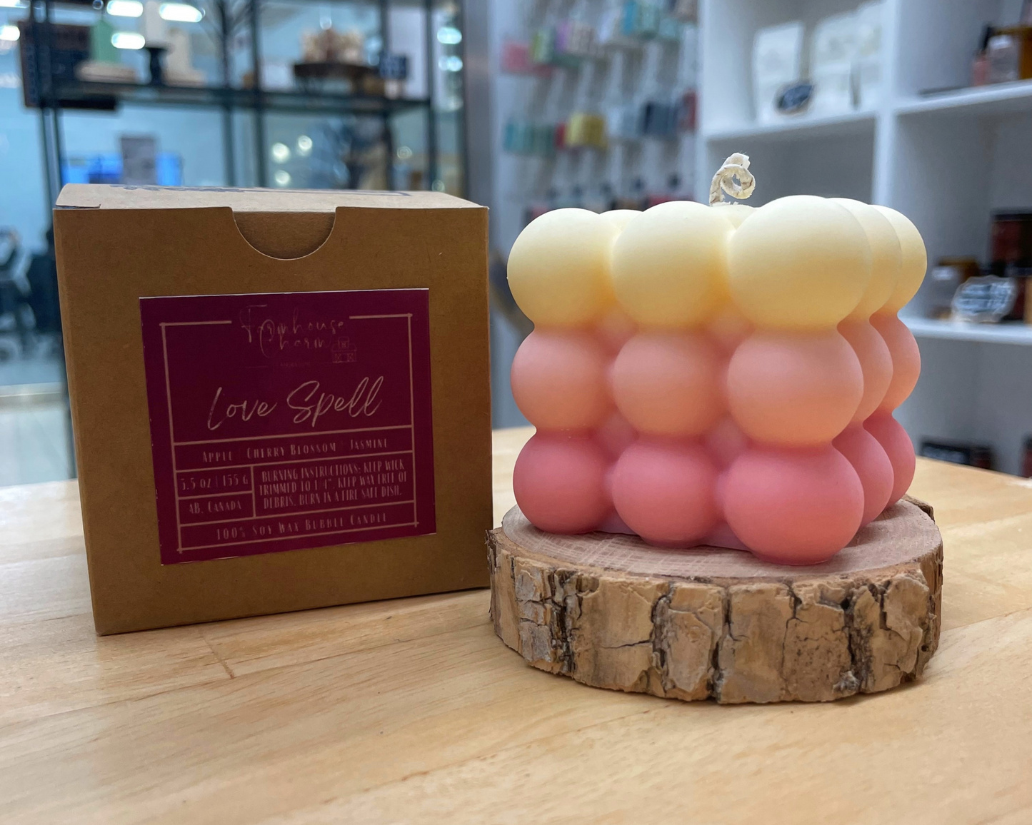 Fell in love with this candle. Love Spell Bubble Soy Candle- Farmhouse Charm is a sweet bouquet of orange, bergamot, cherry blossom and white jasmine with hint of peach and berries on an undertone of musk. Love Spell Bubble Soy Candle- Farmhouse Charm is made with 100% natural soy wax which is biodegradable and sustainable. This candle uses cotton wick. Fragrance is guaranteed to be paraben free and phthalate free. It has pink ombre color.