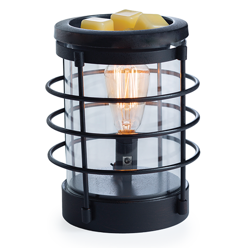 An updated traditional style with wire framing in a matte black finish give this Vintage Bulb Illumination a classic lantern feel. Illumination Fragrance Warmers use a Vintage Bulb to warm wax melts in the dish, releasing their fragrance. Suggested Use: Simply add wax melts to the dish, turn it on, and enjoy your favorite fragrance as it spreads through the room. This warmer works beautifully with 100% Soy Wax Melts by Farmhouse Charm Candles Inc.