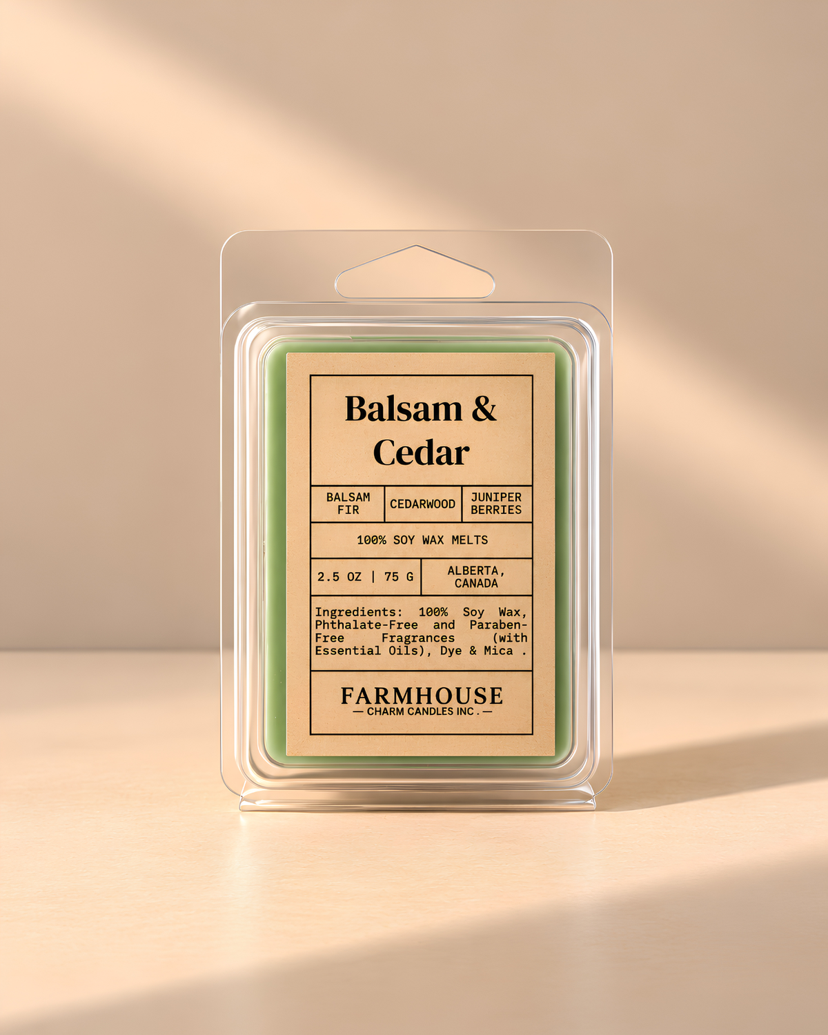 A packaged wax melt product labeled 'Balsam & Cedar' by Farmhouse Charm Candles, shown in a clear plastic clamshell package on a warm beige background with soft diagonal shadows.