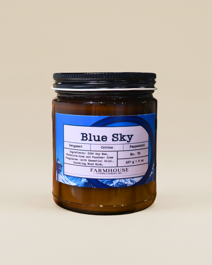 Jar of 'Blue Sky' by Farmhouse Charm Candles on a beige background