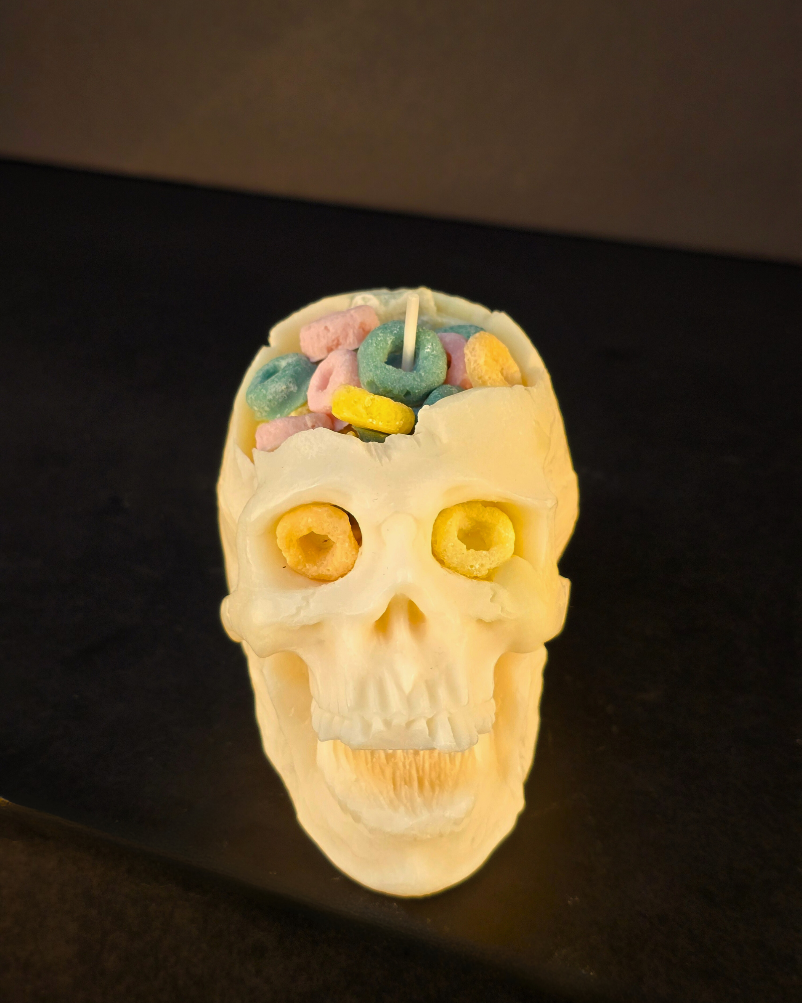 Cereal Killer Skull Candle – soy wax skull-shaped pillar candle with fruity cereal scent, eco-friendly and perfect for Halloween décor. Farmhouse Charm Candles