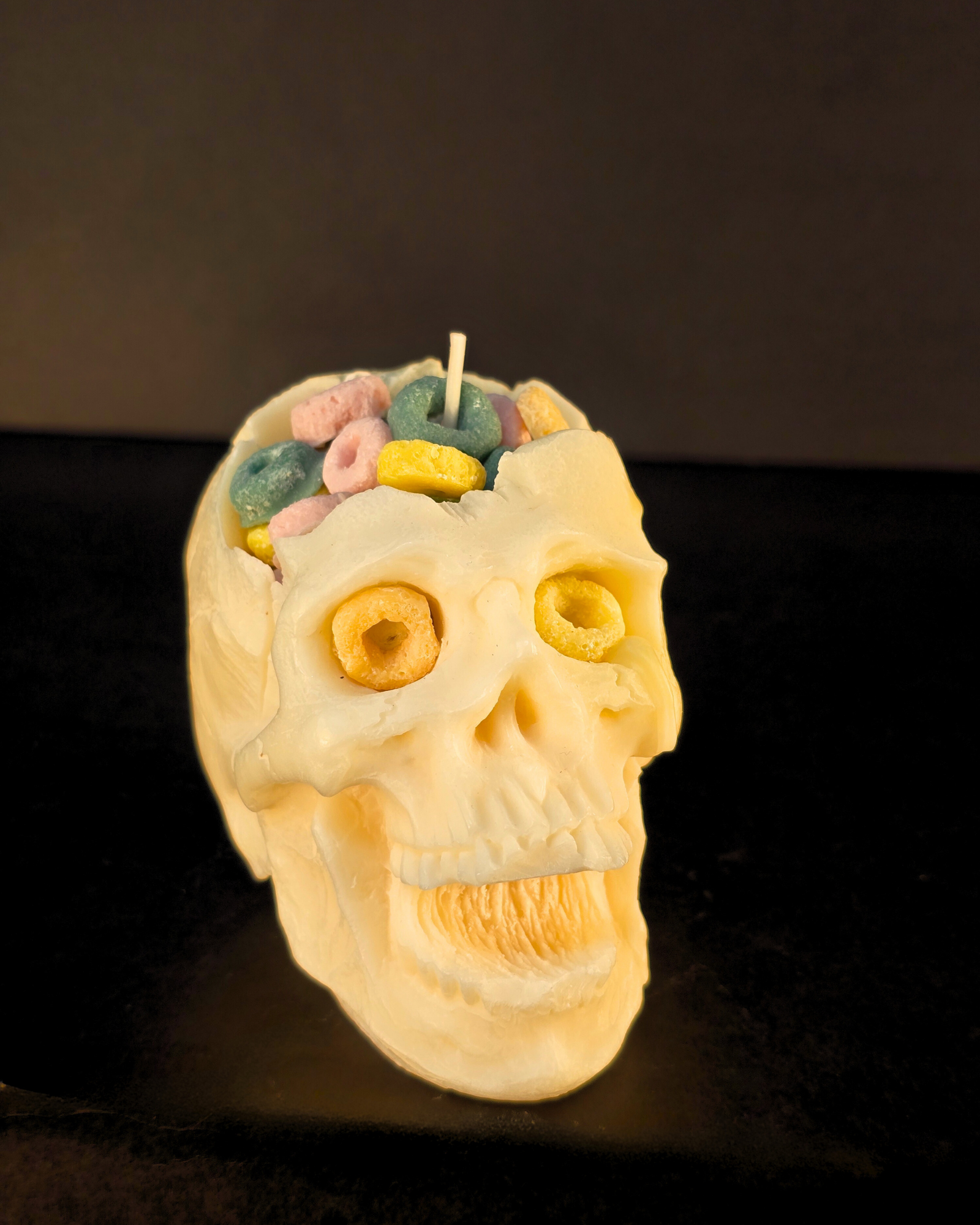 Cereal Killer Skull Candle – soy wax skull-shaped pillar candle with fruity cereal scent, eco-friendly and perfect for Halloween décor. Farmhouse Charm Candles