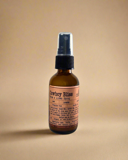 A rugged yet soothing mix of leather, sage, and lavender. This masculine-meets-floral scent brings a touch of the wild west to your home, linens, or car. One spray, and you're in a cozy retreat. Farmhouse Charm Candles