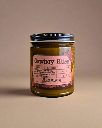 A bold blend of rugged leather, woodsy sage, and calming lavender. This masculine-meets-floral scent brings cozy vibes and western charm. Perfect for any cowboy or cowgirl lookin’ to unwind. www.farmhousecharmcandles.com
