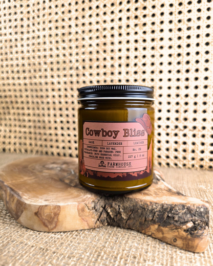 A bold blend of rugged leather, woodsy sage, and calming lavender. This masculine-meets-floral scent brings cozy vibes and western charm. Perfect for any cowboy or cowgirl lookin’ to unwind. www.farmhousecharmcandles.com