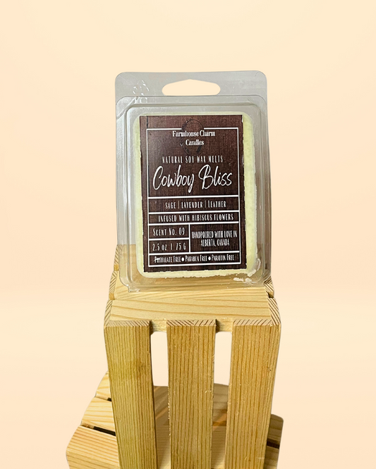 Yeehaw! Get ready to saddle up and experience the new Cowboy Bliss Soy Wax Melts. The blend of woodsy sage, calming lavender, and rugged leather creates an aroma you can't forget. This scent packs a punch with its floral and masculine undertones, making it perfect for any cowboy or cowgirl. You'll be transported to a cozy cabin in the woods, kicking back and enjoying a relaxing evening. Giddy up and try it out! www.farmhousecharmcandles.com