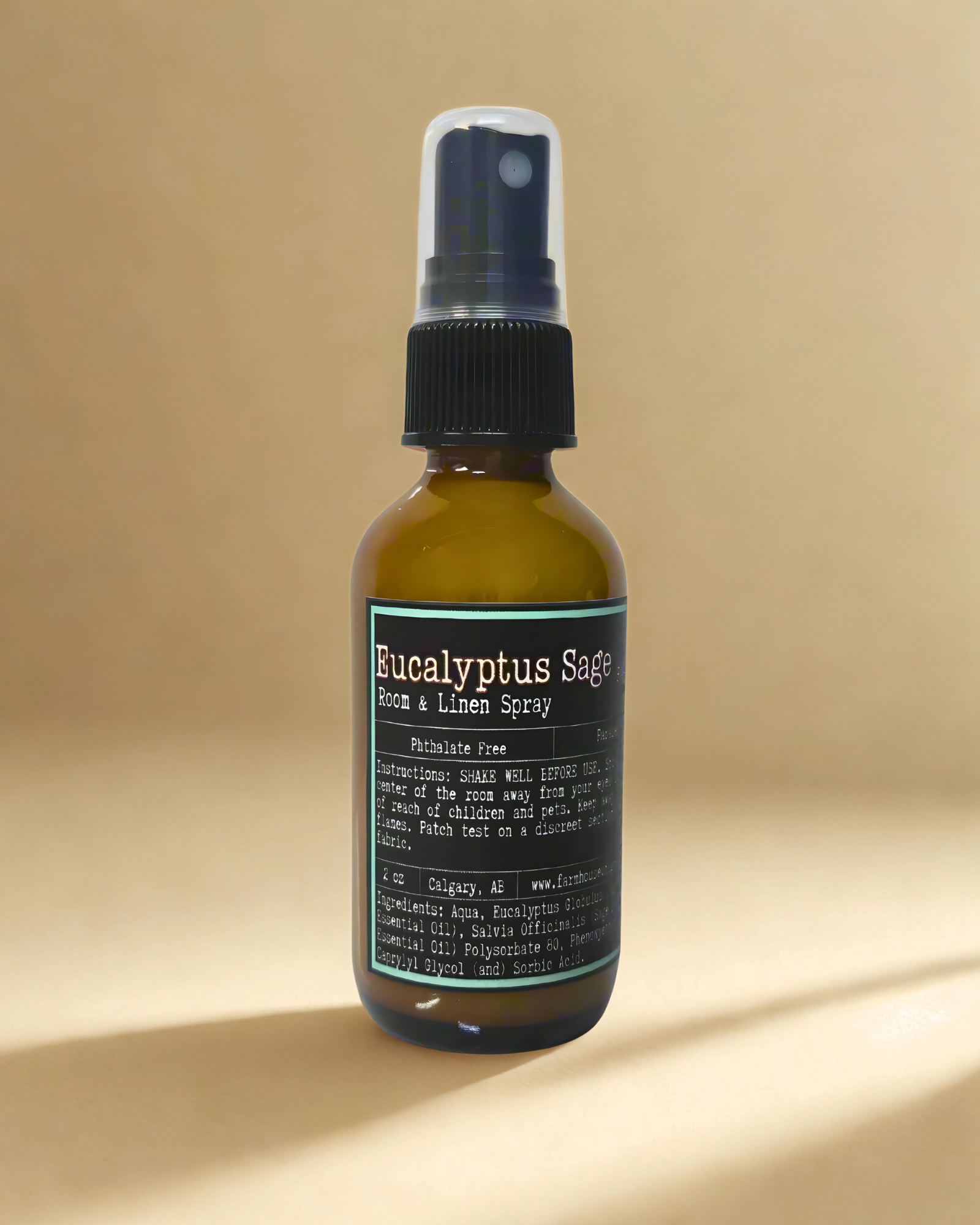 Eucalyptus Sage room and linen spray bottle on a beige background by Farmhouse Charm Candles