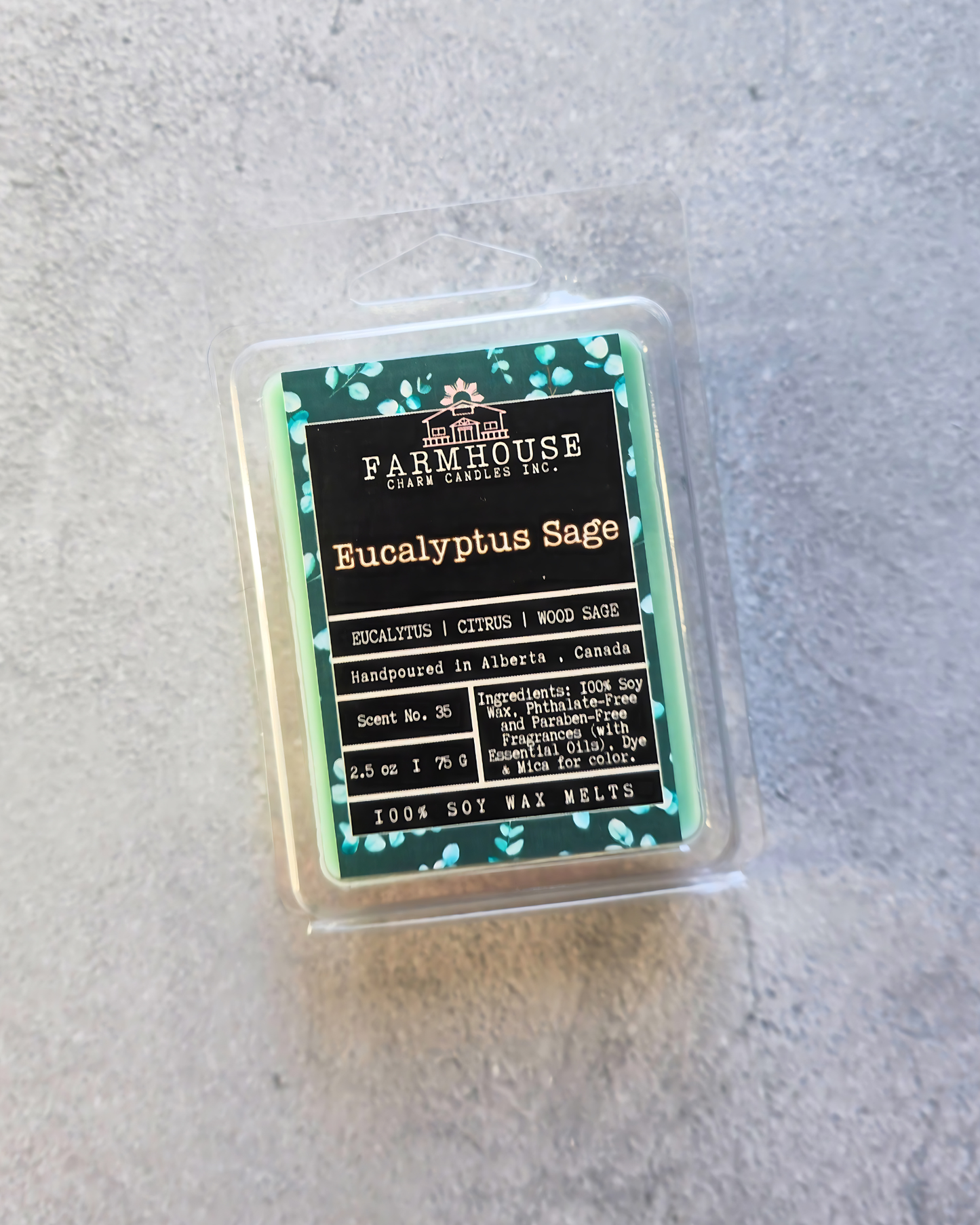 Packaged soy wax melt by 'Farmhouse Charm Candles with label Eucalyprus Sage on a gray background