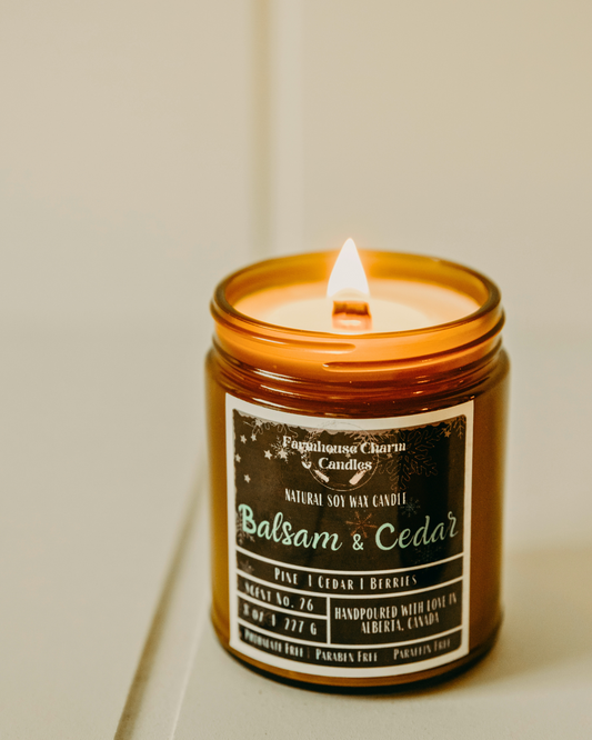 Experience the Joy of the Holidays with Balsam & Cedar Soy Candle. It's scent is a combination of balsam, cedar, and juniper berry, which together create a warm and inviting fragrance. The woody aroma adds texture to the wonderful forest scent, creating the perfect ambiance for the holiday season! www.farmhousecharmcandles.com