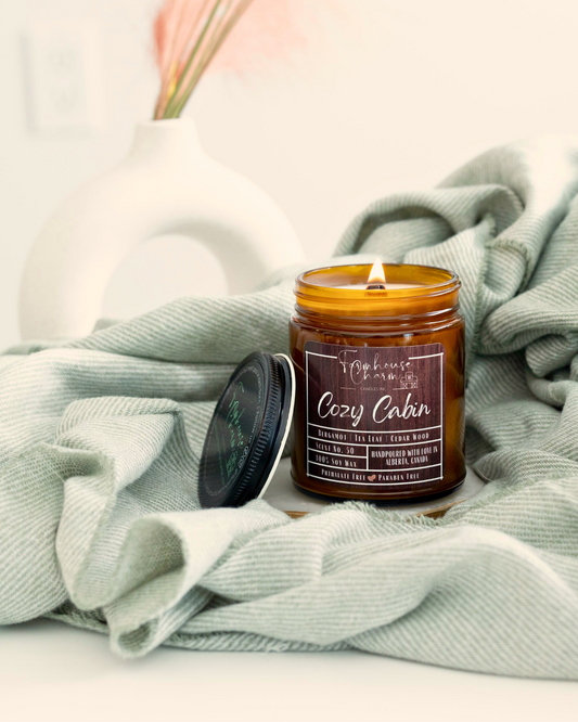 Cozy Cabin Soy Candle is more than just a candle, it's an experience that will take you on a journey to a place of comfort and relaxation. The blend of bergamot, tea leaf, and cedarwood creates a unique fragrance that is perfect for fall and adds a touch of farmhouse charm to any living space. www.farmhousecharmcandles.com