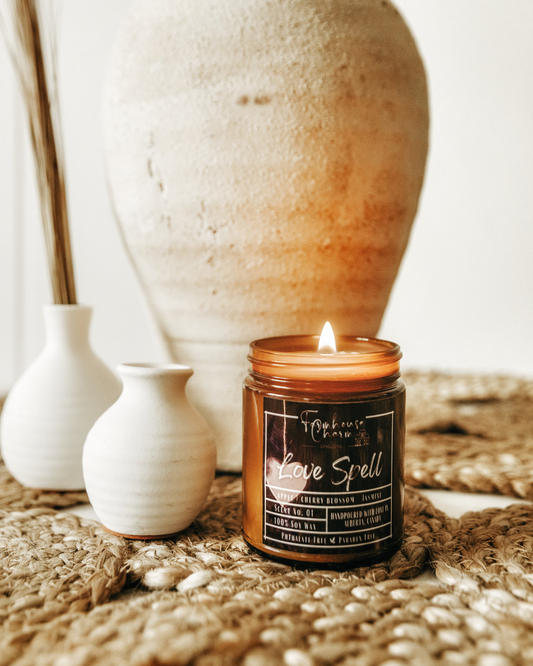 Rediscover the sweet floral scent of Love Spell - Farmhouse Charm Soy Candle. The blend of orange, bergamot, cherry blossom, and white jasmine creates a harmonious and balanced scent that is both floral and fruity, with just the right amount of sweetness. The subtle notes of peach, berries, and musk add depth and complexity to the fragrance. So sit back, light up your Love Spell - Farmhouse Charm Soy Candle, and let the sweet floral scent transport you to a place of calm and serenity.