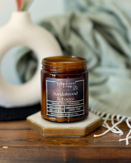 Sandalwood Tobacco Soy Candle is truly a unique and captivating scent that is sure to please anyone looking for a warm and cozy aroma. The combination of tobacco leaf and cedar creates a deep, musky scent that is both luxurious and masculine. The addition of sandalwood adds a touch of sweetness to the blend, while the soft moss finish brings a subtle earthiness to the overall aroma. www.farmhousecharmcandles.com