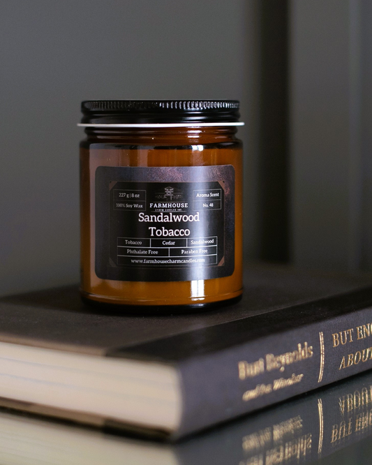 Transport yourself to cozy evenings by the fireplace with our Sandalwood Tobacco Soy Candle. It's like wrapping yourself in a warm blanket of nostalgia. The blend of tobacco leaf and cedar gives off a rich, musky aroma that's reminiscent of simpler times. With a hint of sweet sandalwood and a touch of earthy moss, it's the perfect scent for creating a relaxed and inviting atmosphere. www.farmhousecharmcandles.com