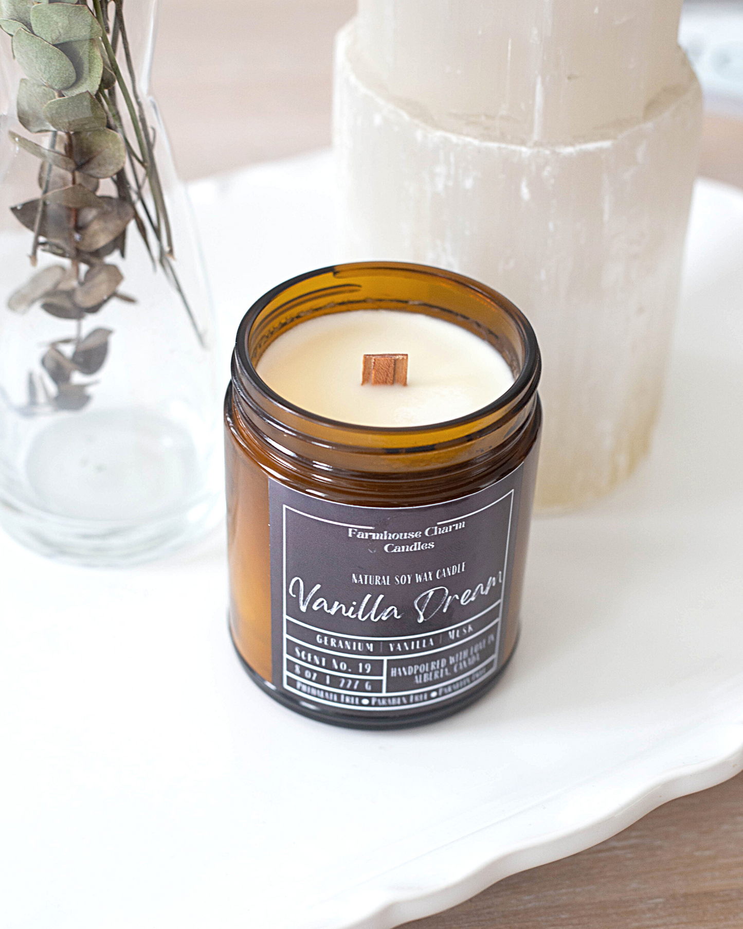 Experience the luxurious aroma of Vanilla Dream- Farmhouse Charm Soy Candle. Step up your candle game with this unique vanilla fragrance that will not disappoint. Indulge in a dreamy and lavish scent that awakens your senses with a blend of toasted vanilla, sweet geranium florals, and a touch of musk.  size: 8 oz (227 g)  The candle is hand poured with love in Alberta, Canada. It has an approximate burn time of 50 hours.