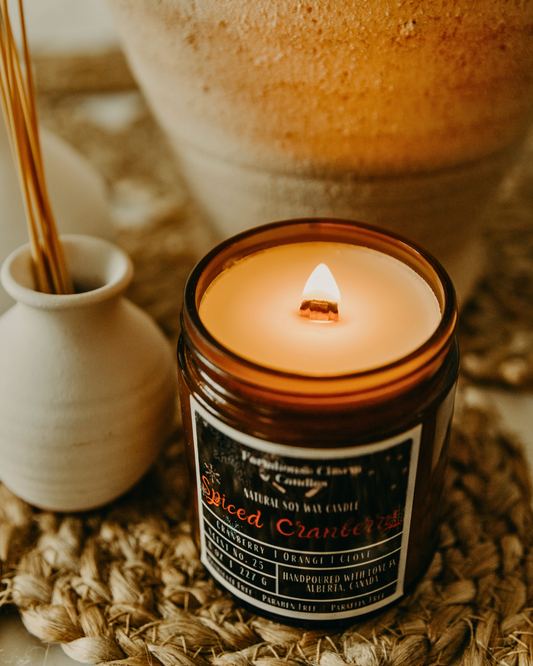 Experience the Festive Season with Spiced Cranberry Soy Candle.  Our Spiced Cranberry Soy Candle embodies the true essence of the holiday spirit. The sweet and inviting aroma will fill any room with warmth and comfort. The tart cranberry and mulberry notes provide a refreshing and fruity scent, complemented by the tangy orange that adds a zesty twist. The combination of spicy clove and warm cinnamon creates a cozy ambiance, perfect for chilly winter nights. www.farmhousecharmcandles.com