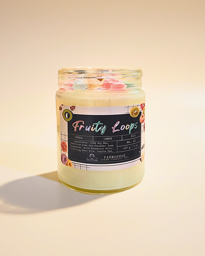 Jar of 'Fruity Loops' cereal  soy candle by Farmhouse Charm Candles with a colorful label on a beige background