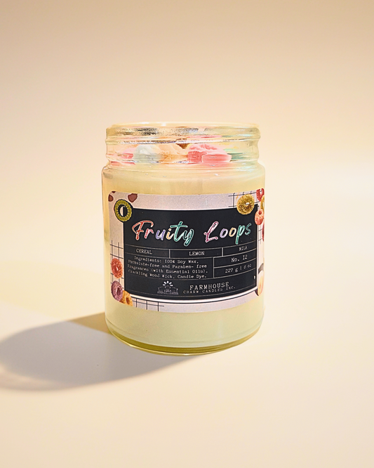 Jar of 'Fruity Loops' cereal  soy candle by Farmhouse Charm Candles with a colorful label on a beige background