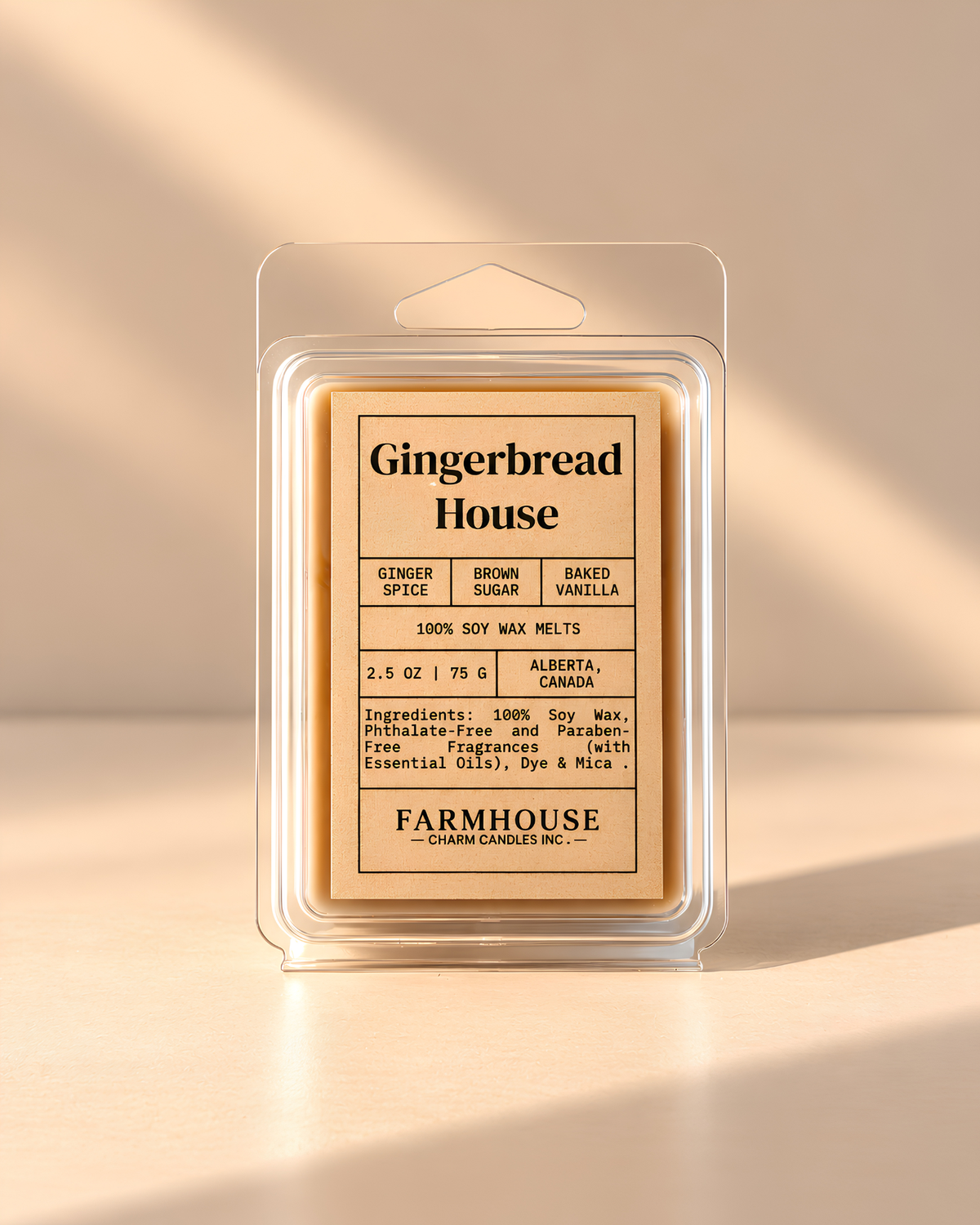 A packaged wax melt product labeled 'Gingerbread House' by Farmhouse Charm Candles, shown in a clear plastic clamshell package against a warm beige background with soft diagonal shadows.