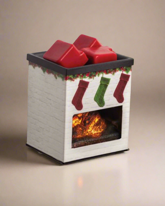 White brick fireplace plug-in fragrance warmer with hanging Christmas stockings design, glowing LED light, and metal applique—ideal for small spaces and use with soy wax melts.