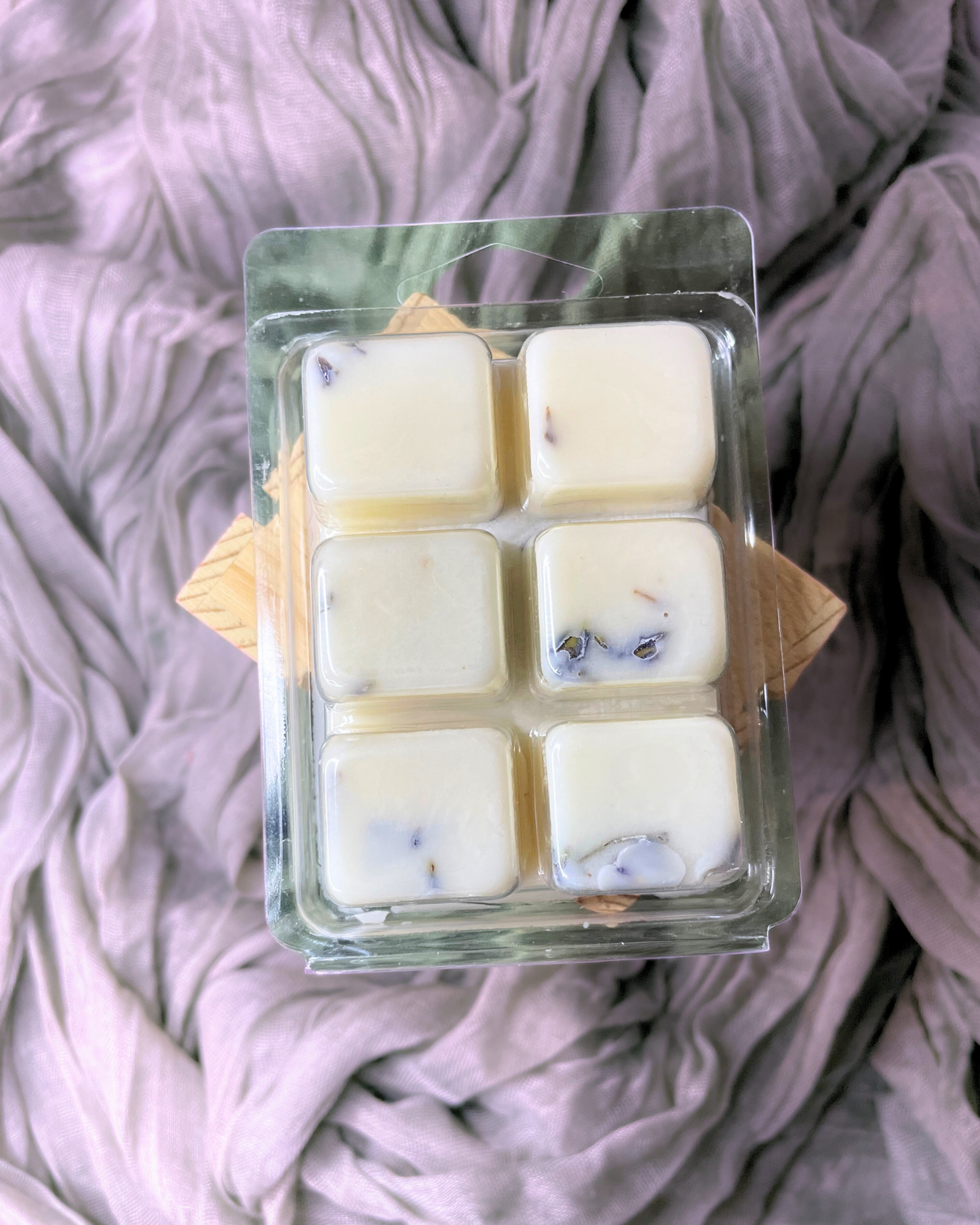 Lavender Field Soy Wax Melts- Farmhouse Charm is our latest blend of lavender. It has a deep and sophisticated blend of French Lavender and exotic amber with tones of tonka beans and musk.  This rich and warm bouquet will fill your home with coziness and delight you after a long day. This wax melts is infused with natural lavender buds to enhance the aroma. www.farmhousecharmcandles.com