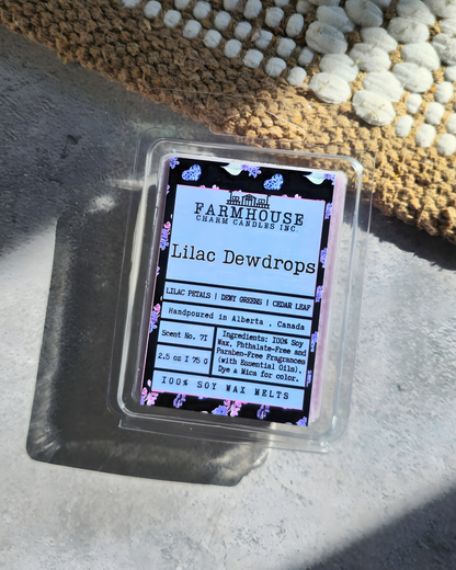 A fresh and elegant floral fragrance featuring blooming lilac petals, crisp dewy green leaves, and a soft touch of cedar leaf for a gentle woodsy finish. This scent captures the feeling of lilacs in full spring bloom—clean, airy, and beautifully inviting, bringing the freshness of a spring garden into your home. Lilac Dewdrops Soy Wax Melts - Farmhouse Charm Candles