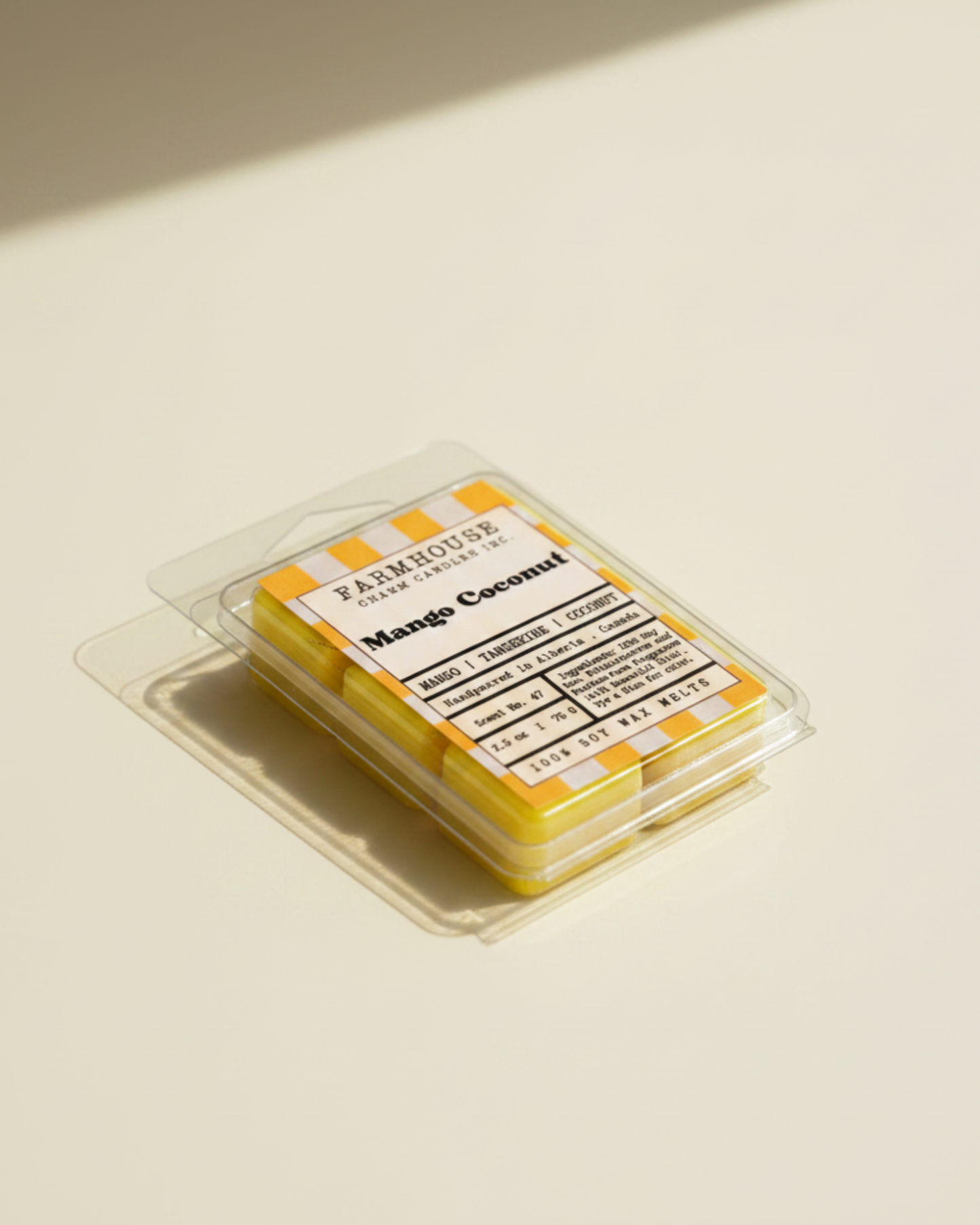 Pack of Farmhouse Charm Candles Mango Coconut wax melts on a white background