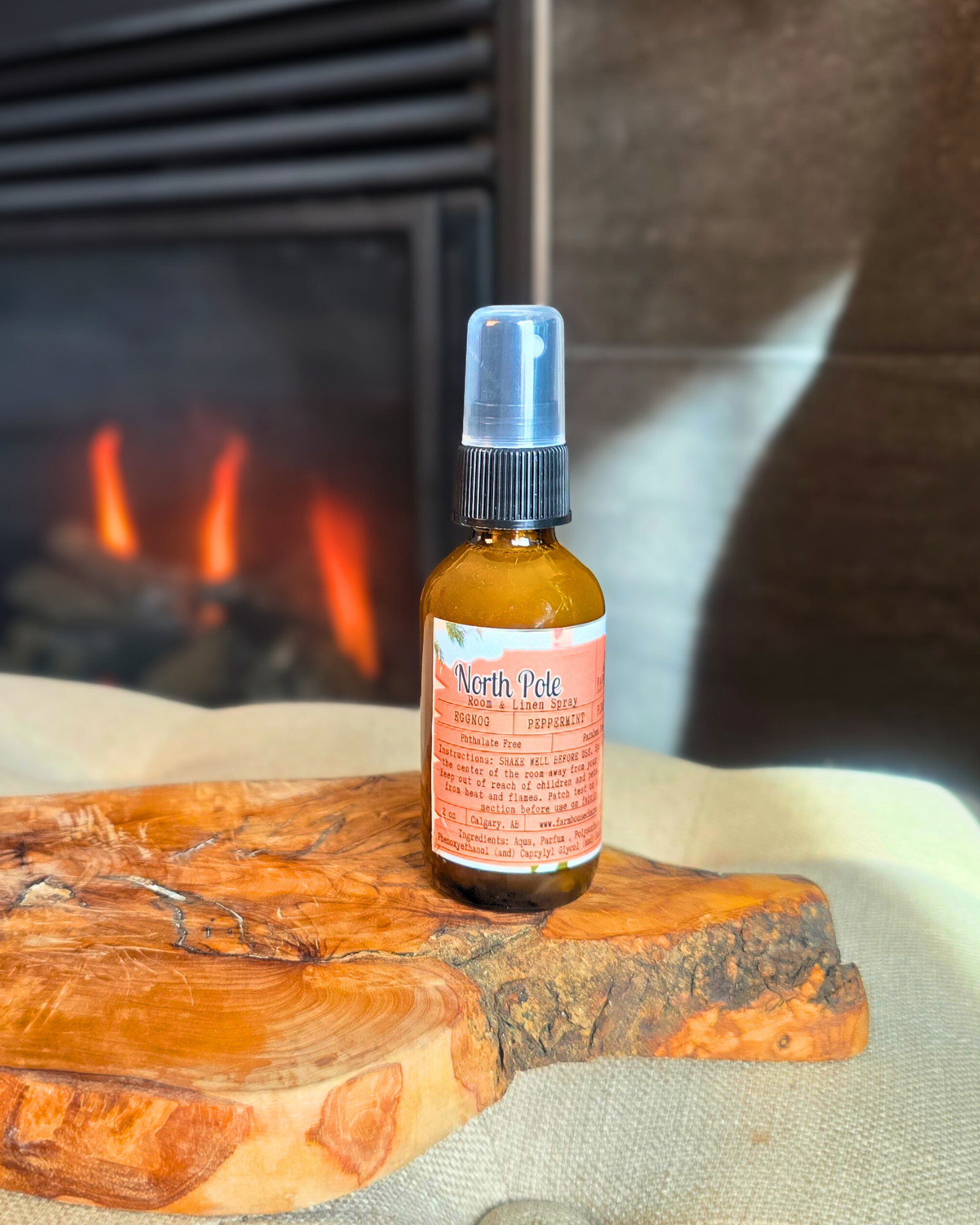 North Pole Room & Linen Spray bottle  capturing the cozy Christmas scent of eggnog, peppermint, and pinecone
